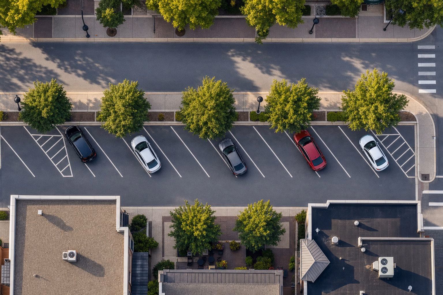 Aerial view of cars parked in a suburban downtown parking area